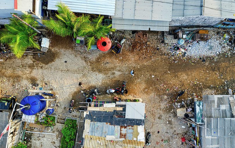 Aerial view of roofs and unpaved road, Jakarta, Indonesia